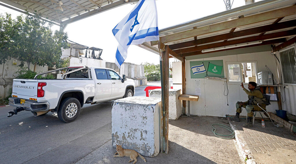 An Israeli soldier secures a checkpoint at the entrance of Ghajar, Sept. 7, 2022