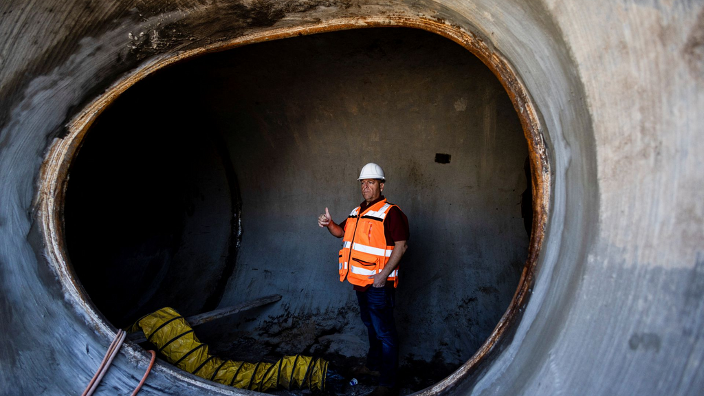 A man gestures as construction work is done to connect the city of Beit Shean to the national water carrier project, as part of an initiative by Mekorot, Israel's national water company, near Kfar Yehoshua in northern Israel, January 23, 2023 