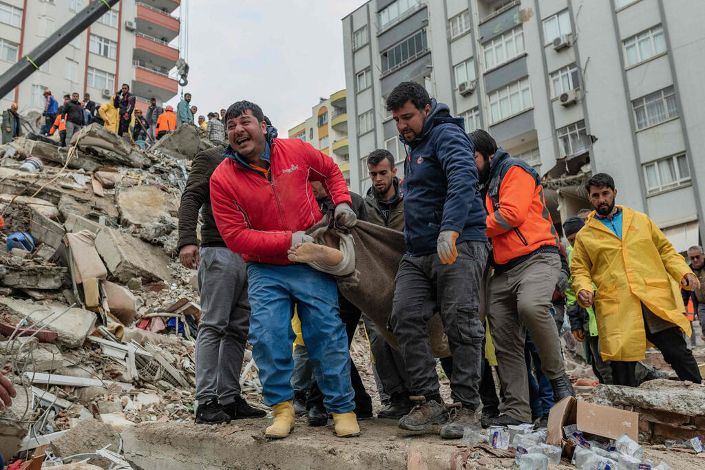 Bodies taken out of rubble in Adana Turkey after massive quake 