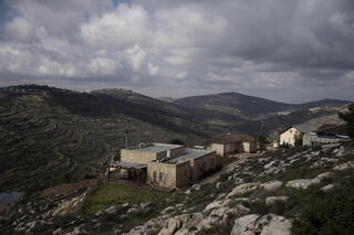 Houses sit on a hill at the West Bank settlement outpost of Givat Harel