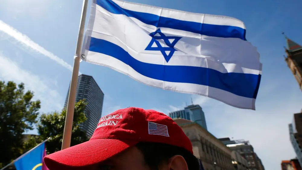A marcher carries an Israeli flag in Boston, Massachusetts, United States