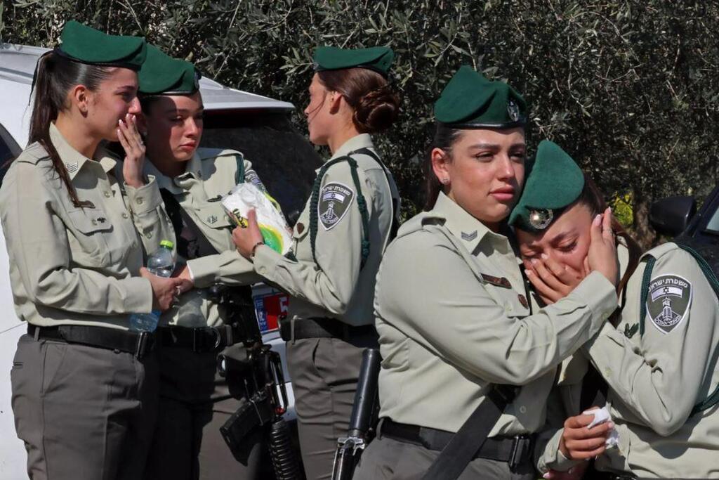 Israeli police mourn during the funeral of a fellow officer killed in a stabbing attack carried out by a Palestinian boy in annexed east Jerusalem, in the Bedouin town of Hussniyya in northern Israel on February 14, 2023