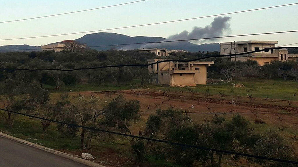 A handout image released on March 12, 2023 by the official Syrian Arab News Agency (SANA) shows smoke billowing from a site targeted by Israeli airstrikes in Masyaf in the central Hama countryside.