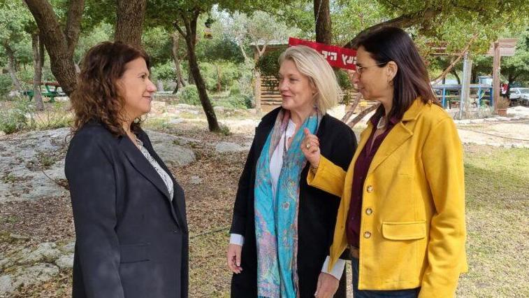 fat Ovadia-Luski, chairwoman of KKL-JNF, left, speaks to Karine Bolton, director of international relations, center, and Anat Gold, director of the Central Region