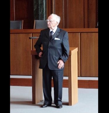 In 2012, Benjamin Ferencz poses in Courtroom 600 of the Palace of Justice, where the Nuremberg Trials were held 65 years earlier 