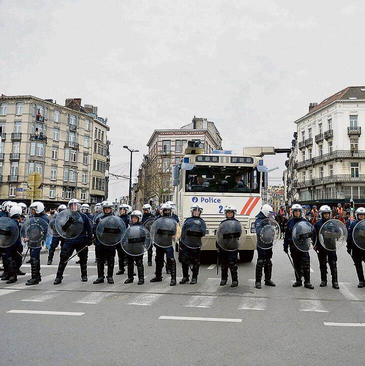 Riot police in a section of Brussels where many terrorists came from
