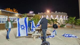 Students hang Israeli flags throughout al-Sayed 