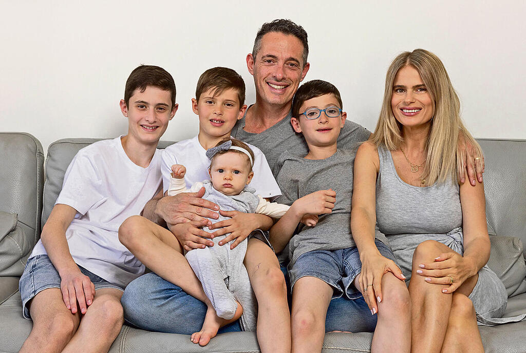Arik and Efrat Rozental and their children at home in Israel