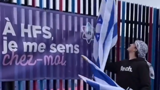 Man tearing down Israeli flags outside Jewish day school, Montreal, Canada 