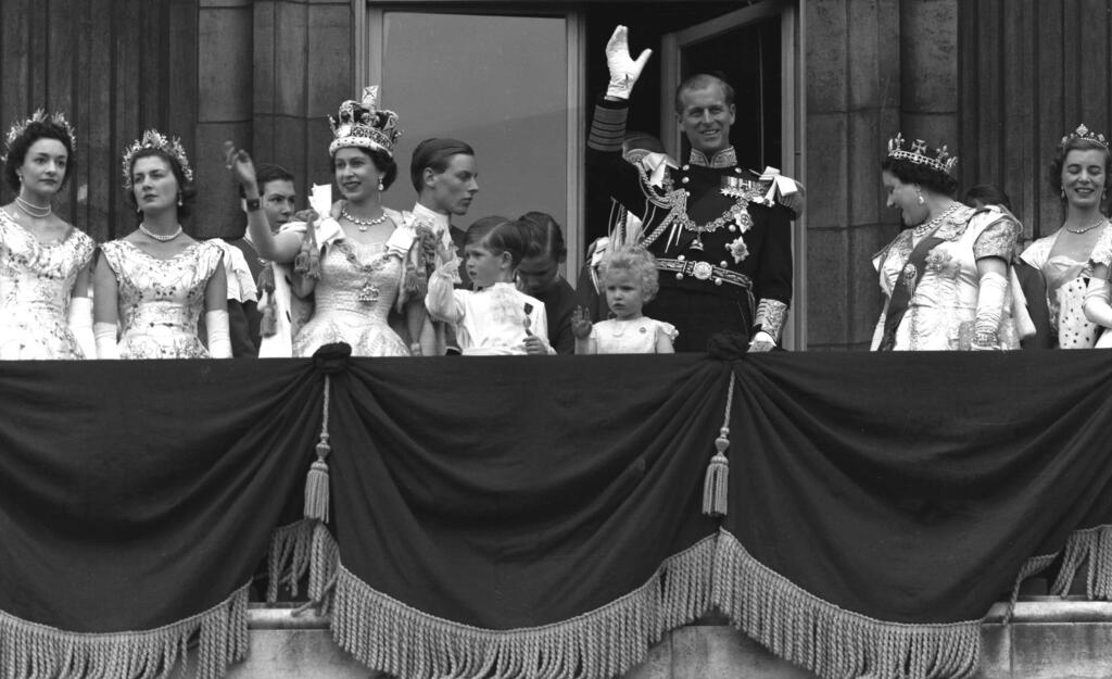 Queen Elizabeth II and Prince Philip, Duke of Edinburgh, gather with other members of the Royal Family following her coronation 