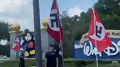 People displaying Nazi flags and symbols protest outside the entrance to Walt Disney World Resort in Orlando, Florida, U.S. June 10, 2023