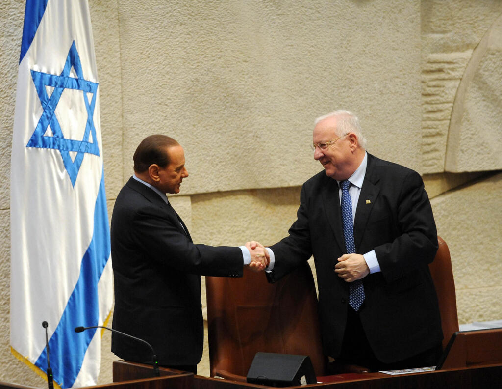 Silvio Berlusconi greets Israel's then-president, Reuven Rivlin, at the Knesset in 2010. 
