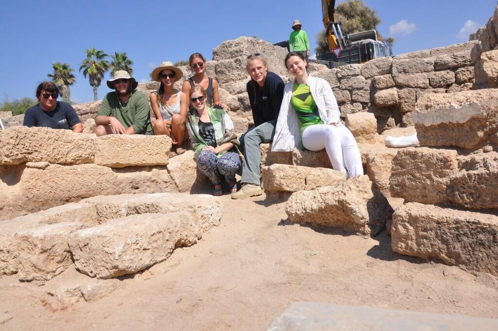 Beverly Goodman Tchernov (second from right) and her team of researchers pose at a site along the Caesarea Maritima coastline where they believe housed evidence of a tsunami deposit 