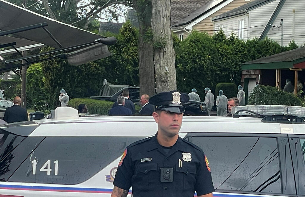 Suffolk County Police and investigators are pictured at the scene of the arrest of a suspect in multiple murders of up to 10 women on Long Island in Massapequa Park, New York, U.S., July 14, 2023 