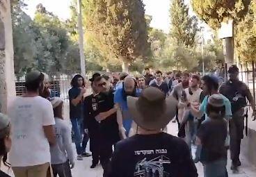 Police remove a Jewish man suspected of violation status quo regulation on Temple Mount 