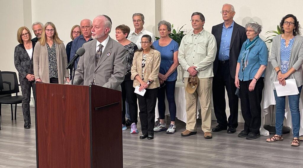 Rabbi Jeffrey Myers leads survivors and families of the attack on the Tree of Life synagogue in a prayer of thanks, at the Jewish Community Center in Pittsburgh, Aug. 2, 2023 