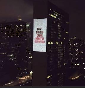 Protesters project anti-Netanyahu message on the UN building 