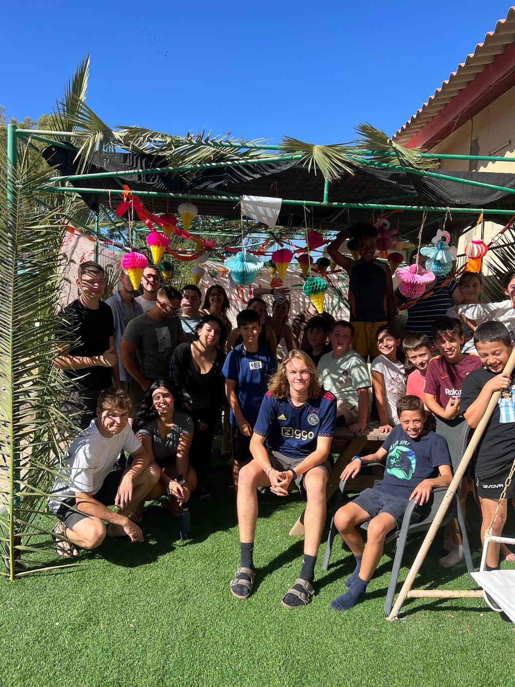 Masa Israel Journey fellows from all around the world, have already completed the building of the Sukkah in Kibbutz Yagur, where they live and volunteer, together with the children of the Kibbutz
