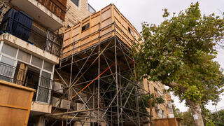 A dangerous sukkah built on scaffolding in Jerusalem