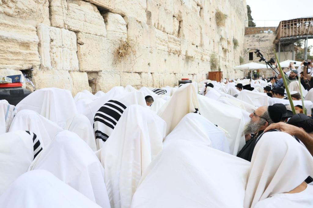 Kohanim wrapped in prayer shawl Western Wall Plaza for Priestly Blessing 