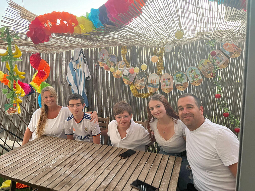 Judith Romang, Daniel Grunblatt and their three children, Valentina (16), Julian (14) and Lelo (12), immigrated from Argentina - and are celebrating Sukkot for the first time in Israel