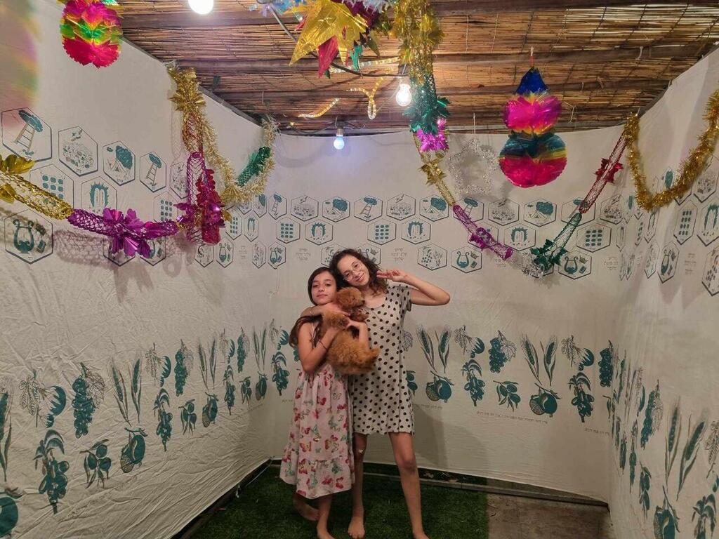 Nachum family from Petach Tikva in their beautiful sukkah 