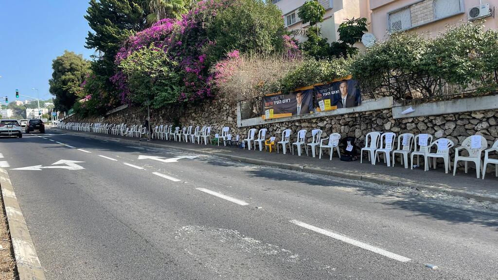 Empty chairs line up Haifa streets as families seek to keep their captivity top of mind 