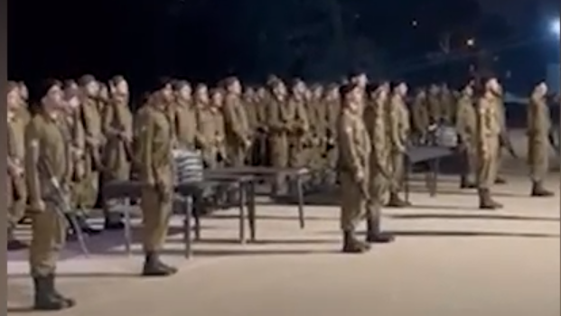 Haredi IDF recruits singing Israel's national anthem Hatikvah at basic training graduation ceremony
