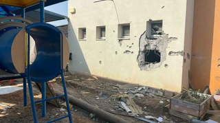 Some of the damage in the fortified walls of one of the daycare buildings at Kibbutz Be'eri 
