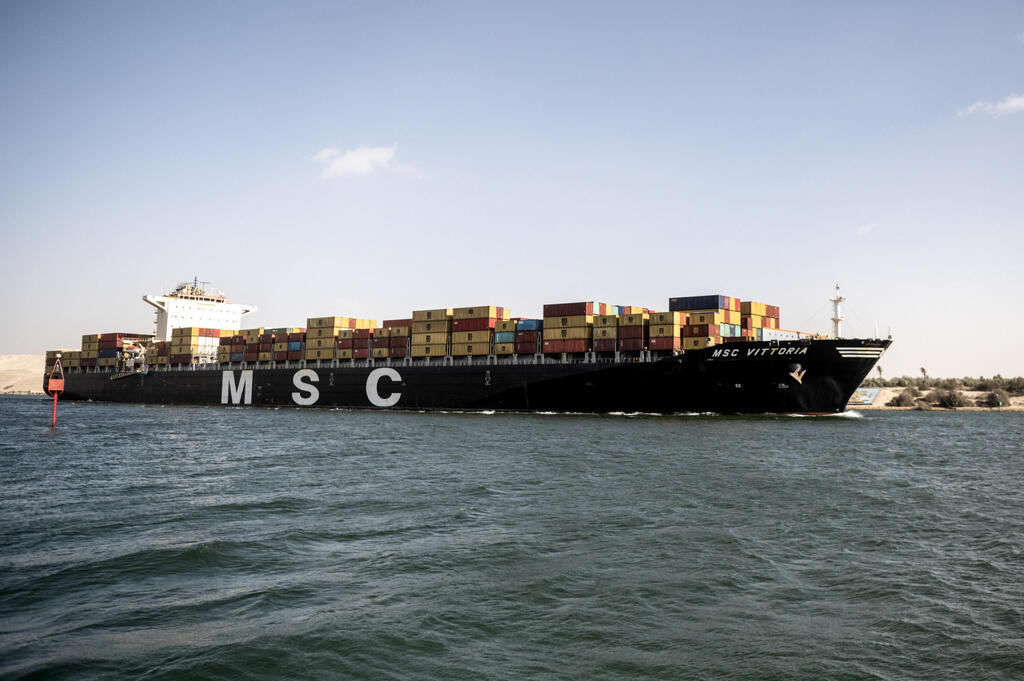 A Mediterranean Shipping Company (MSC) container ship crosses the Suez Canal towards the Red Sea