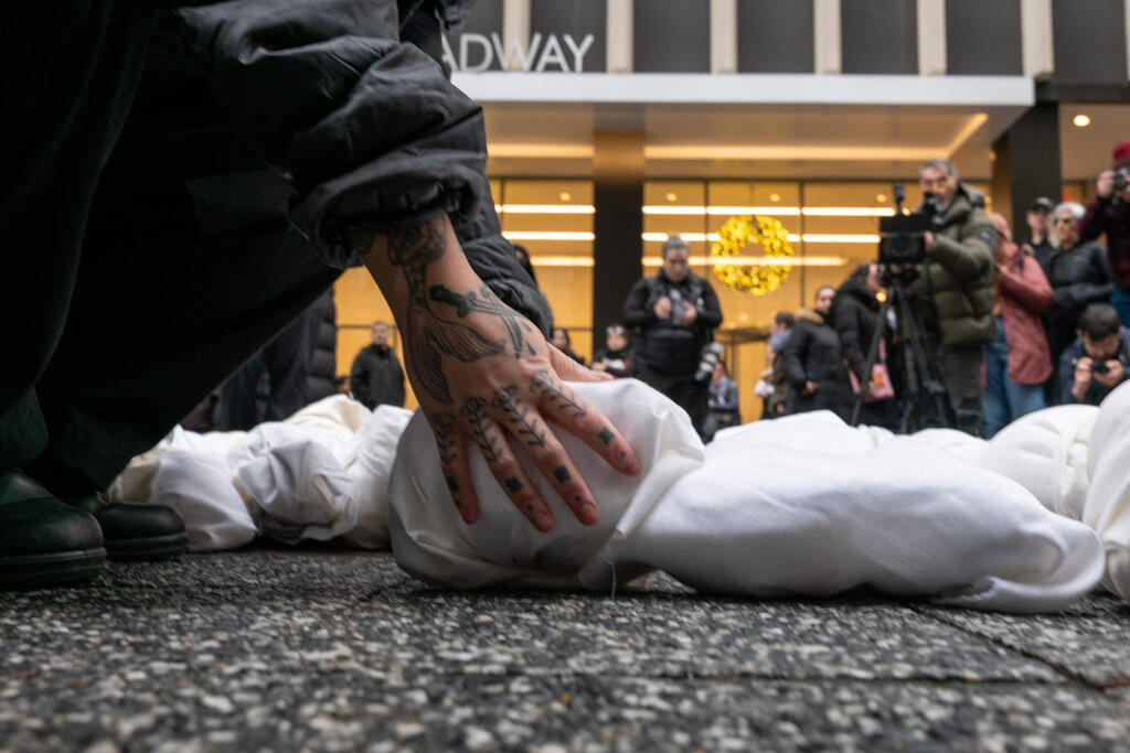 Protester lays down doll representing dead Gazan child in New York protest 