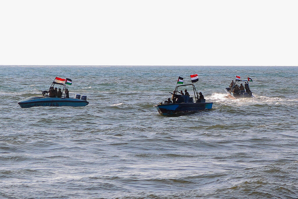 Members of the Yemeni Coast Guard affiliated with the Houthi group patrol the sea