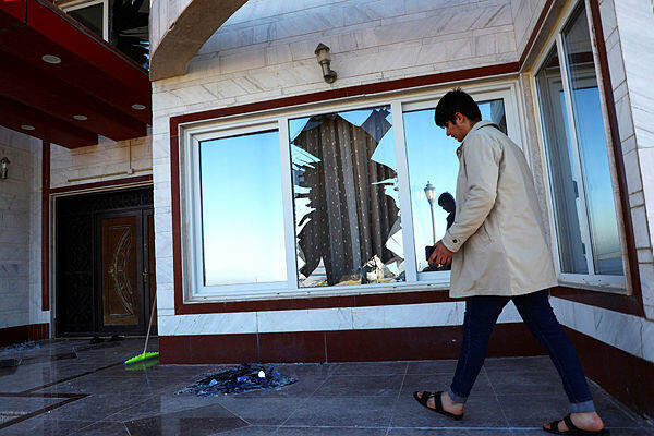 Iraqi man inspects damage after Iran strike