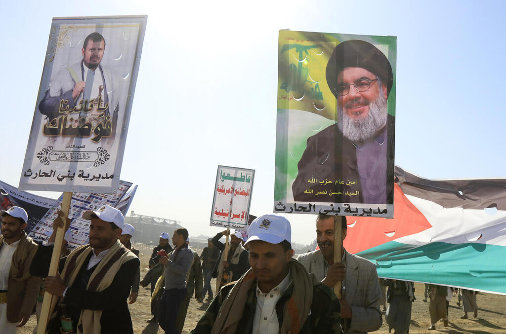 Houthi supporters demonstrate against Israel carrying picture of Hezbollah leader Hassan Nasrallah 