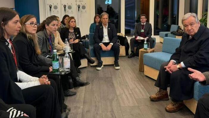 Israeli business tycoon Eytan Stibbe (center) during a meeting relatives of hostages had with UN Sec. Gen. Antonio Guterres in New York