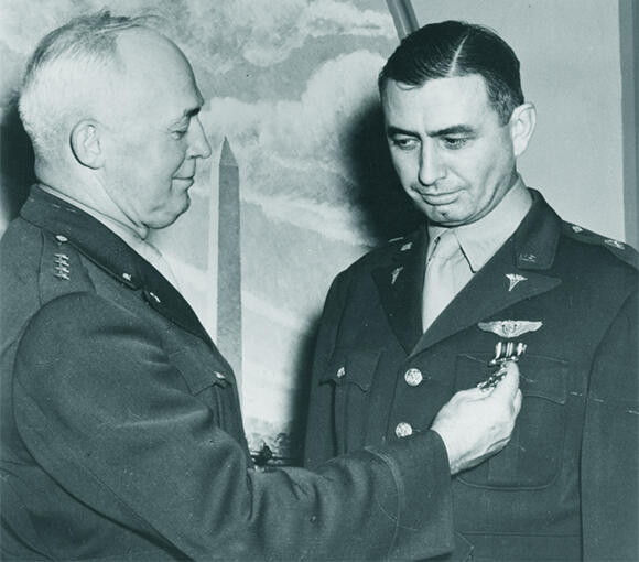 The doctor who wanted to send women to space. Randy Lovelace (right) receiving the Distinguished Flying Cross for his contribution to pilot safety during World War II