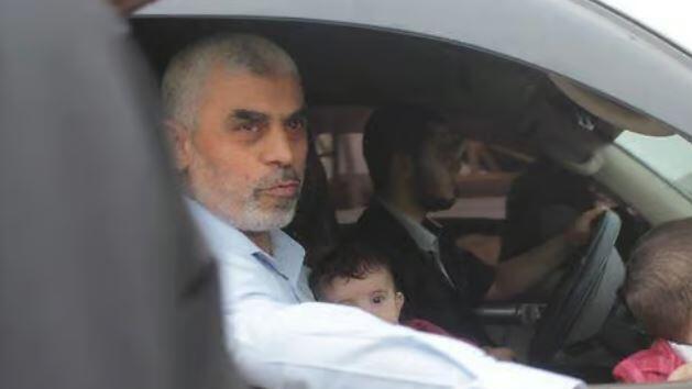 Hamas leader Yahya Sinwar with two of his children 