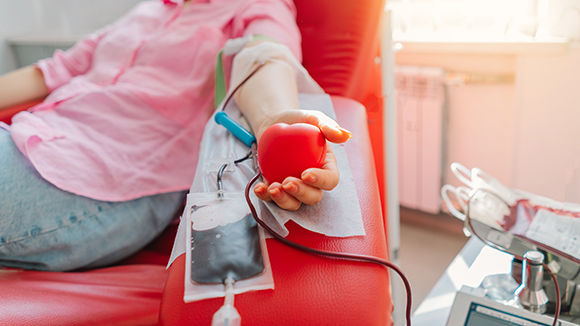 One of the treatments for blood component deficiency is blood transfusion: transferring blood or some of its specific fractions from a donor to a recipient. A woman donating blood 