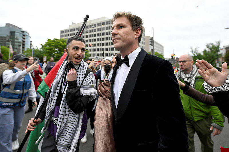 Guests arriving at the White House correspondents' dinner are accosted by protesters against the war in Gaza