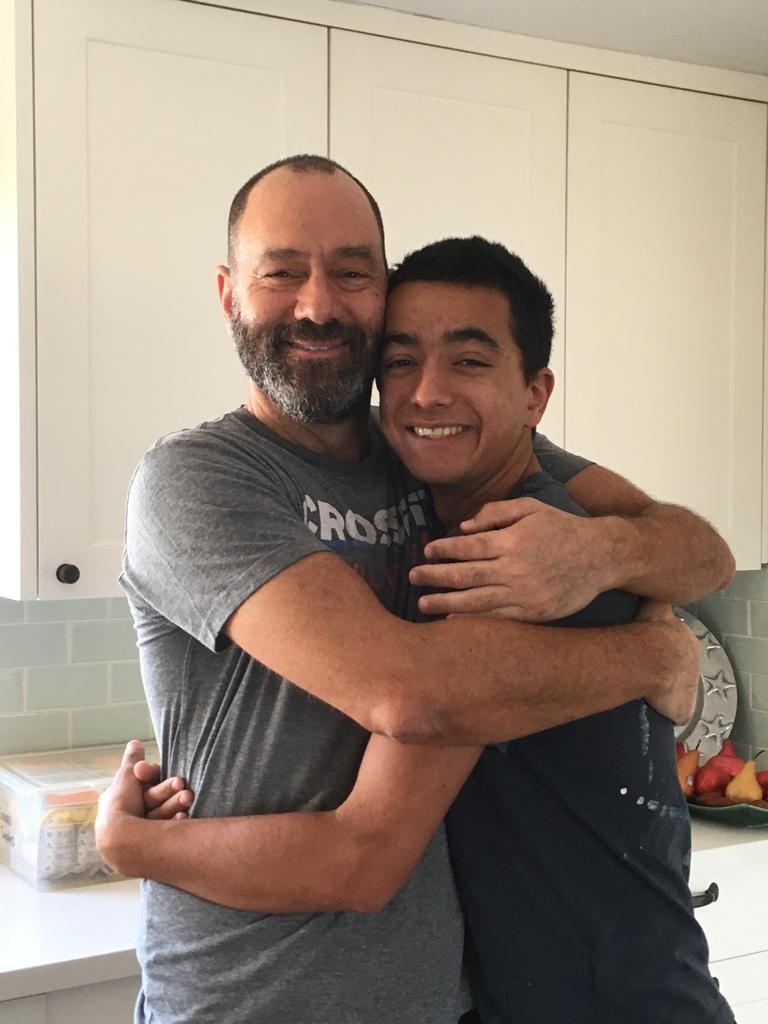 Jon Polin in the family's kitchen with son, Hersh