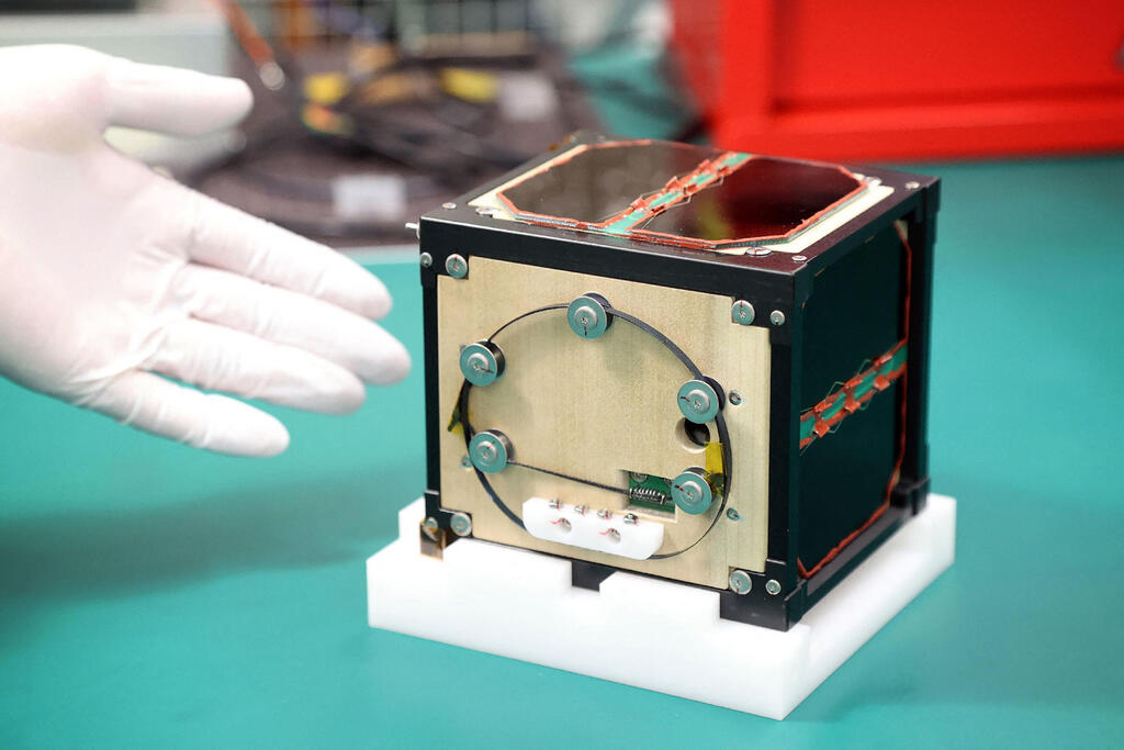 World's first wooden satellite LignoSat shown during a press conference at Kyoto University in Kyoto on May 28, 2024 