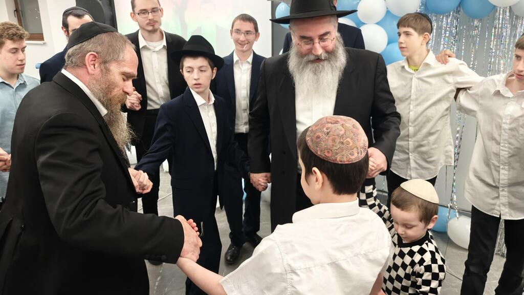 Boy recites prayer during bar mitzvah celebration in Odessa, Ukraine 
