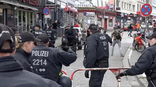 Screen grab of moment a man carrying an axe was shot down by police officers in Hamburg, before Euro 2024 match 