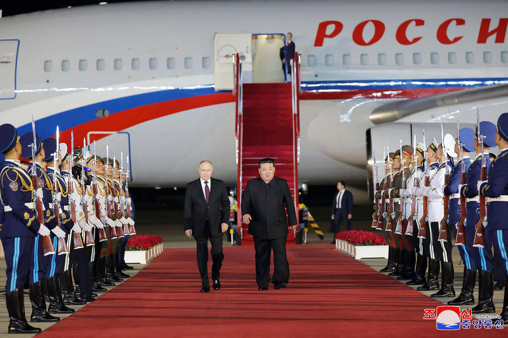 Russian President Vladimir Putin inspects honor guard with N. Korea leader Kim 