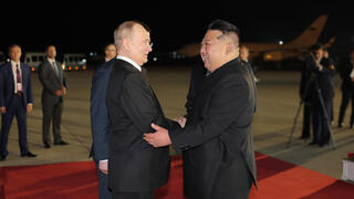 Russian President Vladimir Putin (L) received by North Korean leader Kim Jong Un in Pyongyang 