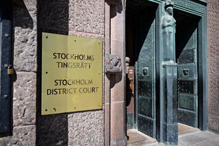 Entrance to the Stockholm District Court after the court acquitted one of the highest-ranking Syrian military officials to be tried in Europe on war crimes charges