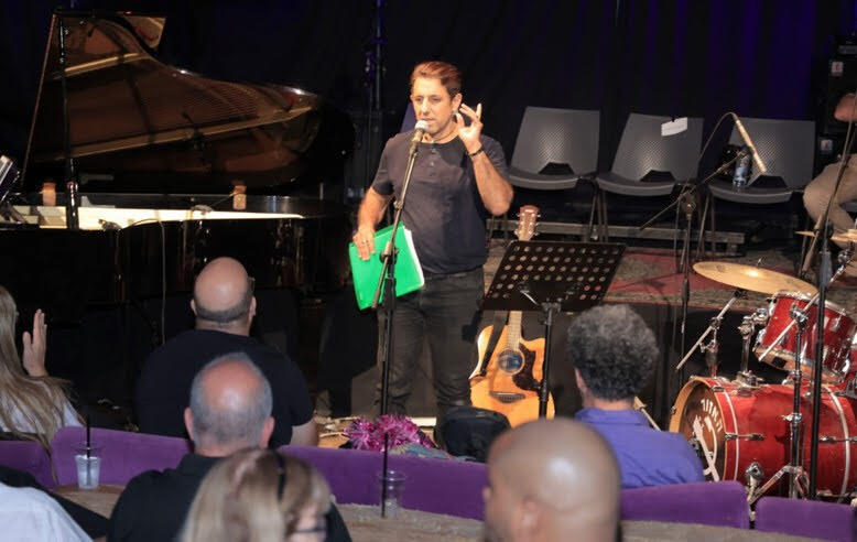 Rubi Reuveny hosting an evening for new voices