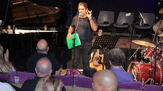 Rubi Reuveny hosting an evening for new voices