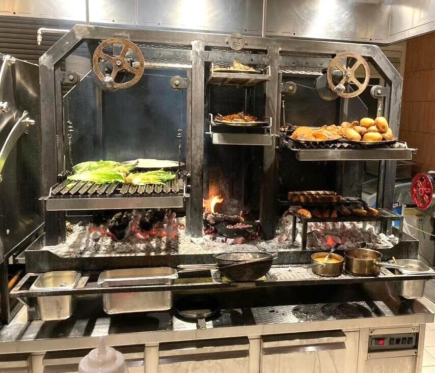 Flame has installed its imposing parilla (Argentinian grill) in an open kitchen (Photo: Buzzy Gordon) Flame has installed its imposing parilla (Argentinian grill) in an open kitchen