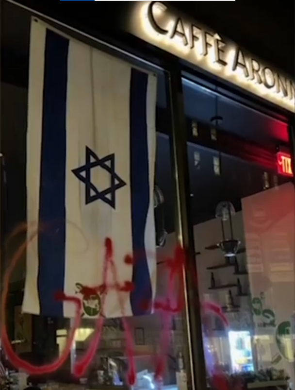Pro-Palestinian slogans spray-painted on Caffè Aronne's windows (Photo: The Ruderman Family Foundation) Pro-Palestinian slogans spray-painted on Caffè Aronne's windows